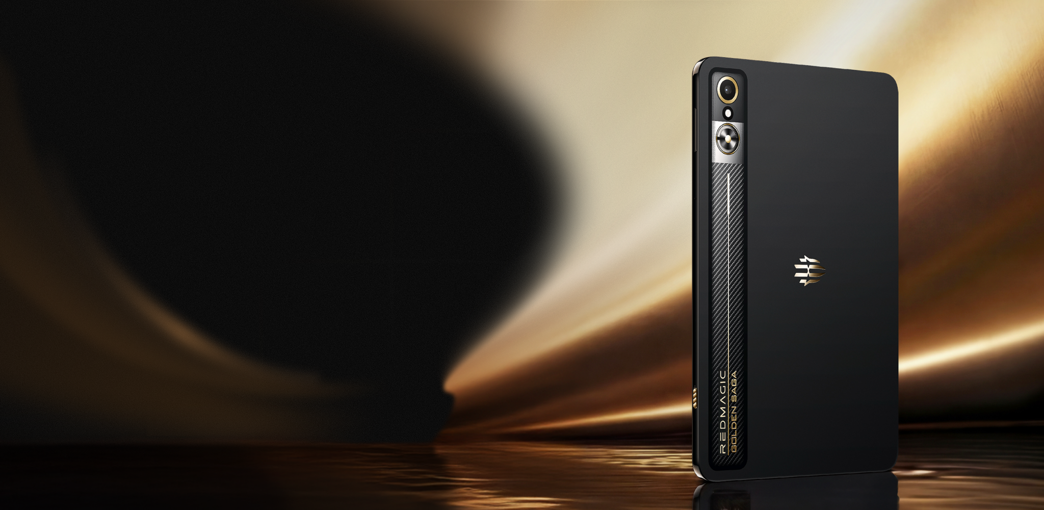 Black smartphone standing upright on a reflective surface with a blurred dark and gold background.